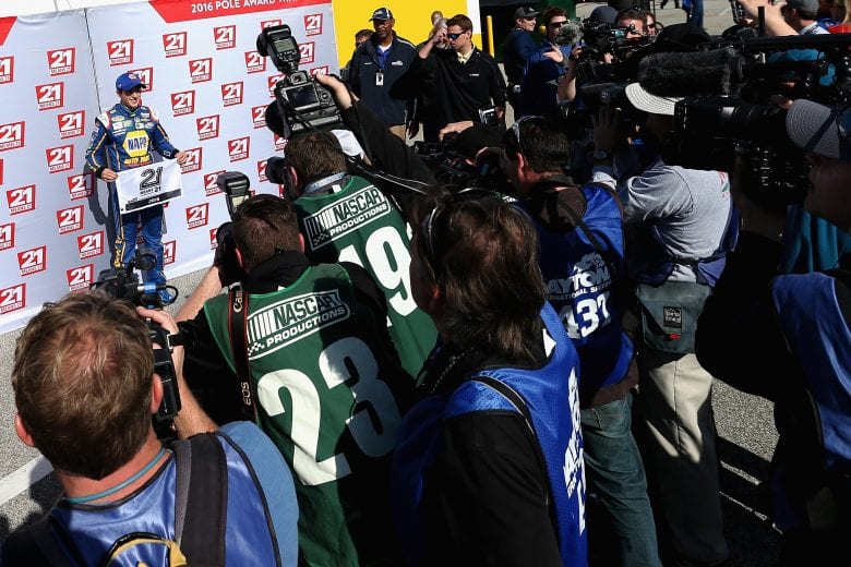 DAYTONA BEACH, FL - FEBRUARY 14: Media surrounds Chase Elliott, driver of the #24 NAPA Auto Parts Chevrolet, as he poses with the 21 Means 21 Pole Award after qualifying for the NASCAR Sprint Cup Series Daytona 500 at Daytona International Speedway on February 14, 2016 in Daytona Beach, Florida. (Photo by Patrick Smith/Getty Images) | Getty Images