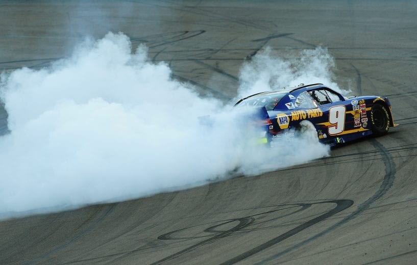 AVONDALE, AZ - NOVEMBER 08: Chase Elliott, driver of the #9 NAPA Auto Parts Chevrolet, celebrates with a burnout after winning the NASCAR Nationwide Series Championship following his fifth place finish in the DAV 200 at Phoenix International Raceway on November 8, 2014 in Avondale, Arizona. (Photo by Rainier Ehrhardt/Getty Images) | Getty Images
