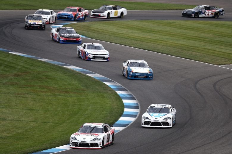 INDIANAPOLIS, INDIANA - JULY 04: Harrison Burton, driver of the #20 DEX Imaging Toyota, leads Chad Finchum, driver of the #66 MBM MOTORSPORTS Toyota, and Alex Labbe, driver of the #90 Prolon/VRVictroriaVille.com Chevrolet, during the NASCAR Xfinity Series Pennzoil 150 at the Brickyard at Indianapolis Motor Speedway on July 04, 2020 in Indianapolis, Indiana. (Photo by Jamie Squire/Getty Images) | Getty Images