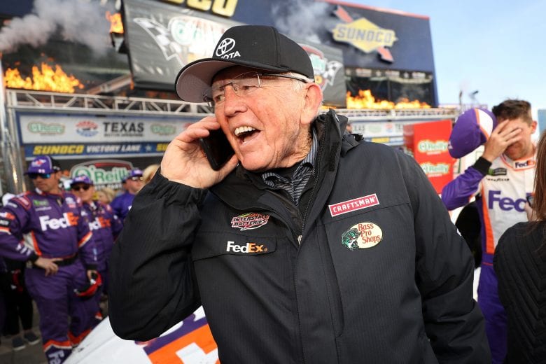 FORT WORTH, TX - MARCH 31: Team owner Joe Gibbs celebrates with Denny Hamlin, driver of the #11 FedEx Office Toyota, after winning the Monster Energy NASCAR Cup Series O'Reilly Auto Parts 500 at Texas Motor Speedway on March 31, 2019 in Fort Worth, Texas. (Photo by Chris Graythen/Getty Images) | Getty Images