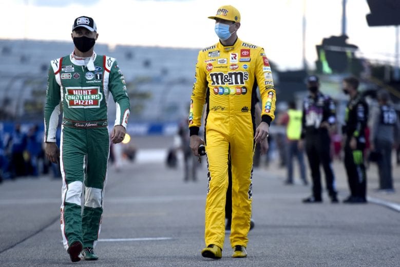 RICHMOND, VIRGINIA - SEPTEMBER 12: Kevin Harvick, driver of the #4 Hunt Brothers Pizza Ford, and Kyle Busch, driver of the #18 M&M's Toyota, walk the grid prior to the NASCAR Cup Series Federated Auto Parts 400 at Richmond Raceway on September 12, 2020 in Richmond, Virginia. (Photo by Jared C. Tilton/Getty Images) | Getty Images