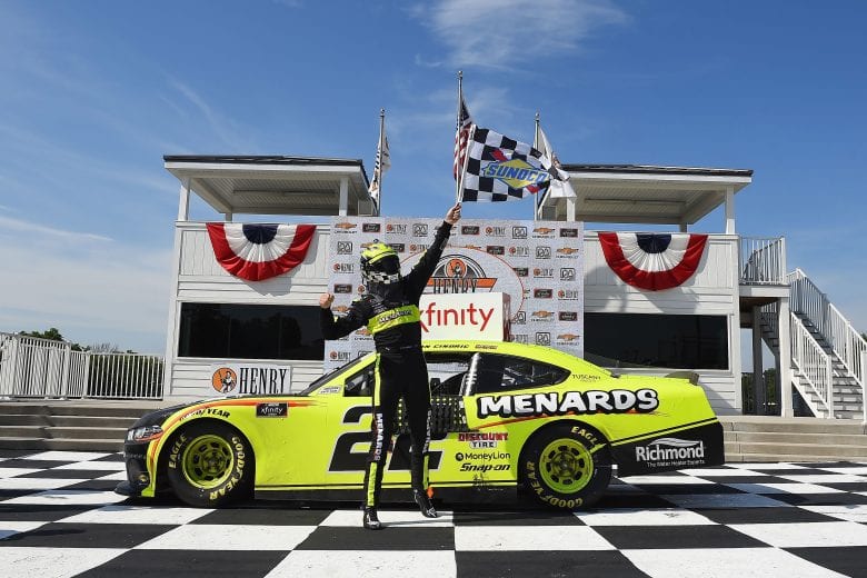 ELKHART LAKE, WISCONSIN - AUGUST 08: Austin Cindric, driver of the #22 Menards/Richmond Ford, celebrates in Victory Lane after winning the NASCAR Xfinity Series Henry 180 at Road America on August 08, 2020 in Elkhart Lake, Wisconsin. (Photo by Stacy Revere/Getty Images) | Getty Images