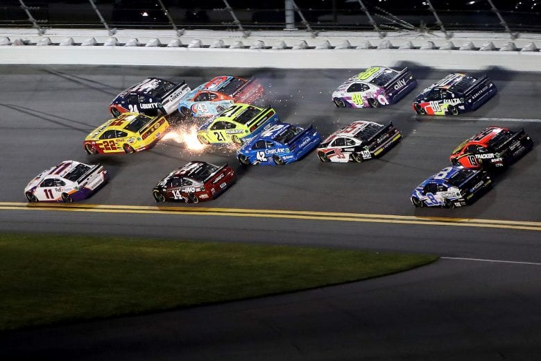 DAYTONA BEACH, FLORIDA - AUGUST 29: Denny Hamlin, driver of the #11 FedEx Express Toyota, Joey Logano, driver of the #22 Shell Pennzoil Ford, and William Byron, driver of the #24 Liberty University Chevrolet, lead the pack during the NASCAR Cup Series Coke Zero Sugar 400 at Daytona International Speedway on August 29, 2020 in Daytona Beach, Florida. (Photo by Brian Lawdermilk/Getty Images) | Getty Images