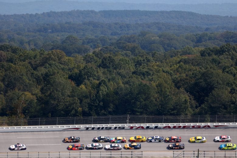 TALLADEGA, ALABAMA - OCTOBER 04: Denny Hamlin, driver of the #11 FedEx Express Toyota, leads the field during the NASCAR Cup Series YellaWood 500 at Talladega Superspeedway on October 04, 2020 in Talladega, Alabama. (Photo by Brian Lawdermilk/Getty Images) | Getty Images