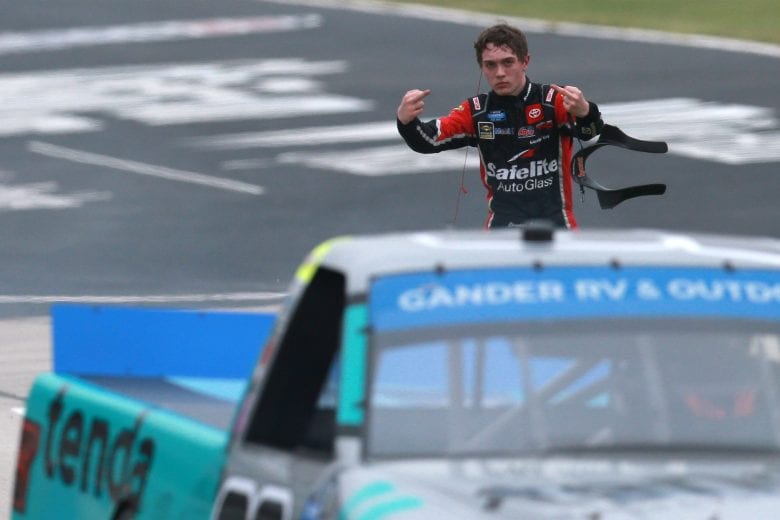 FORT WORTH, TEXAS - OCTOBER 25: Christian Eckes, driver of the #18 Safelite AutoGlass Toyota, reacts to an on-track incident with Ben Rhodes, driver of the #99 Tenda Heal Ford, during the NASCAR Gander RV & Outdoors Truck Series SpeedyCash.com 400 at Texas Motor Speedway on October 25, 2020 in Fort Worth, Texas. (Photo by Sean Gardner/Getty Images) | Getty Images