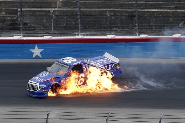 FORT WORTH, TEXAS - OCTOBER 25: Clay Greenfield, driver of the #68 Rackley Roofing Toyota, truck flames up after an on-track incident during the NASCAR Gander RV & Outdoors Truck Series SpeedyCash.com 400 at Texas Motor Speedway on October 25, 2020 in Fort Worth, Texas. (Photo by Brian Lawdermilk/Getty Images) | Getty Images