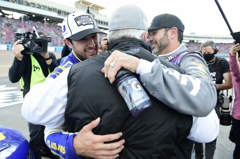 AVONDALE, ARIZONA - NOVEMBER 08: Chase Elliott, driver of the #9 NAPA Auto Parts Chevrolet, is congratulated by Jimmie Johnson, driver of the #48 Ally Chevrolet, and team owner and NASCAR Hall of Famer Rick Hendrick after winning the NASCAR Cup Series Season Finale 500 and the 2020 NASCAR Cup Series Championship at Phoenix Raceway on November 08, 2020 in Avondale, Arizona. (Photo by Jared C. Tilton/Getty Images) | Getty Images
