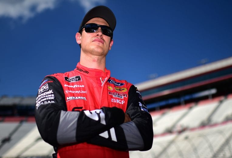BRISTOL, TENNESSEE - AUGUST 16: Joey Logano, driver of the #12 Snap on Ford, stands on the grid during qualifying for the NASCAR Xfinity Series Food City 300 at Bristol Motor Speedway on August 16, 2019 in Bristol, Tennessee. (Photo by Jared C. Tilton/Getty Images) | Getty Images