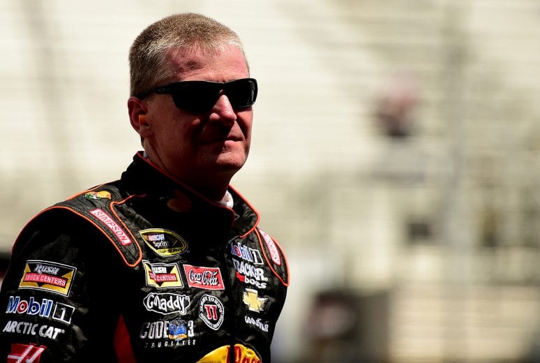 BRISTOL, TN - AUGUST 22: Jeff Burton, driver of the #14 Bass Pro Shops / Mobil 1 Chevrolet, stands in the garage area during practice for the NASCAR Sprint Cup Series Irwin Tools Night Race at Bristol Motor Speedway on August 22, 2014 in Bristol, Tennessee. (Photo by Patrick Smith/Getty Images) | Getty Images