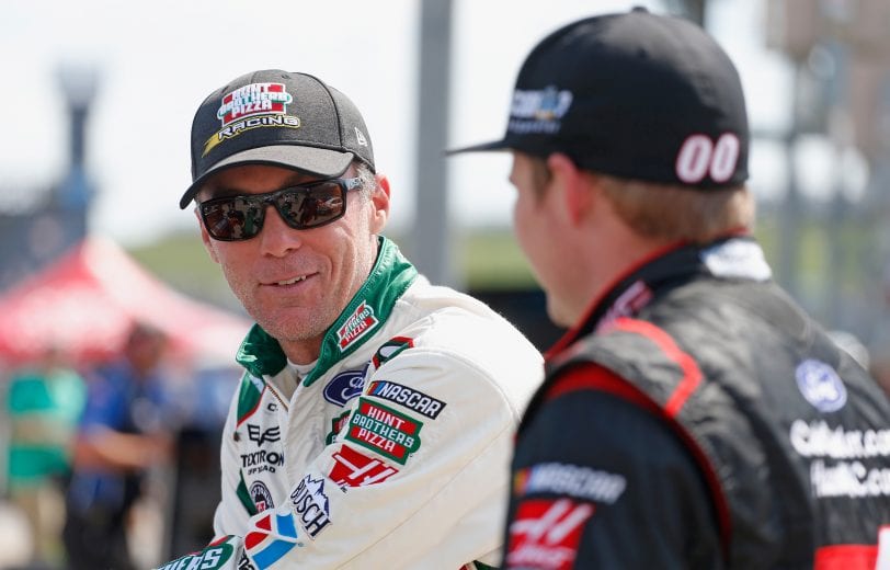 SPARTA, KENTUCKY - JULY 07: Kevin Harvick, driver of the #41 Hunt Brothers Pizza Ford, talks with Cole Custer, driver of the #00 Haas Automation Ford, during qualifying for the NASCAR XFINITY Series Alsco 300 at Kentucky Speedway on July 7, 2017 in Sparta, Kentucky. (Photo by Matt Sullivan/Getty Images) | Getty Images