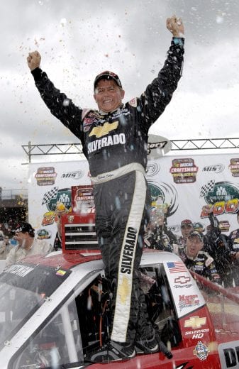 BROOKLYN, MI - JUNE 18:  Dennis Setzer, driver of the #46 Chevrolet Silverado Chevrolet, celebrates after winning the NASCAR Craftsman Truck Series Paramount Health Insurance 200 on June 18, 2005 at the Michigan International Speedway in Brooklyn, Michigan.  (Photo by Rusty Jarrett/Getty Images) | Getty Images
