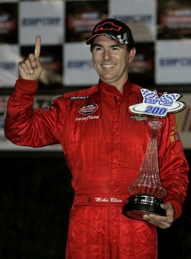 HAMPTON, GA - OCTOBER 28:  Mike Bliss, driver of #16 Chevrolet, celebrates in victory lane after winning  the NASCAR Craftsman Truck Series EasyCare Vehicle Service Contracts 200 at Atlanta Motor Speedway on October 28, 2006 in Hampton, Georgia.  (Photo by Rusty Jarrett/Getty Images for NASCAR) | Getty Images