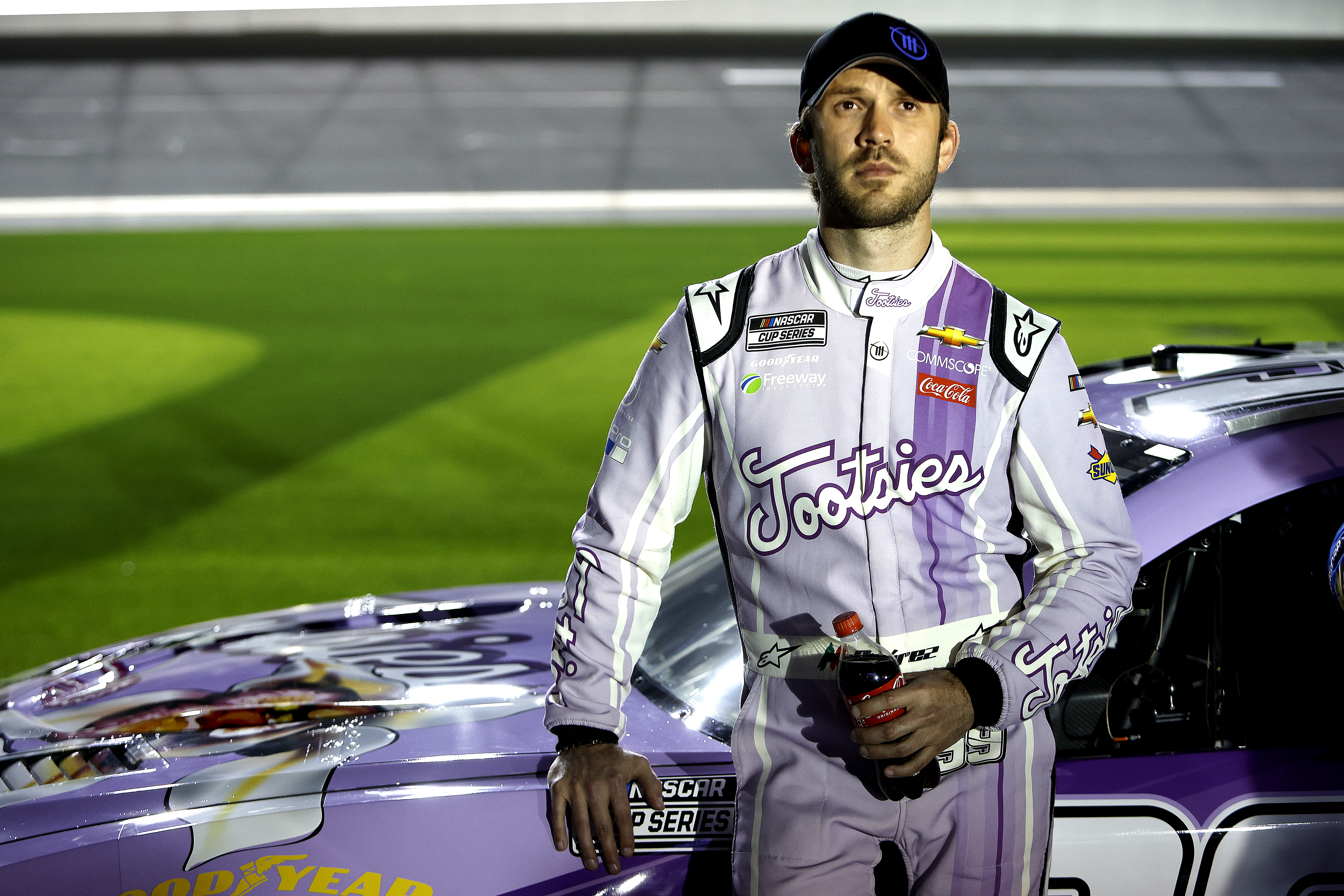 DAYTONA BEACH, FLORIDA - FEBRUARY 16: Daniel Suarez, driver of the #99 Tootsies Orchid Lounge Chevrolet, stands on the grid during qualifying for the NASCAR Cup Series 64th Annual Daytona 500 at Daytona International Speedway on February 16, 2022 in Daytona Beach, Florida. (Photo by Sean Gardner/Getty Images) | Getty Images