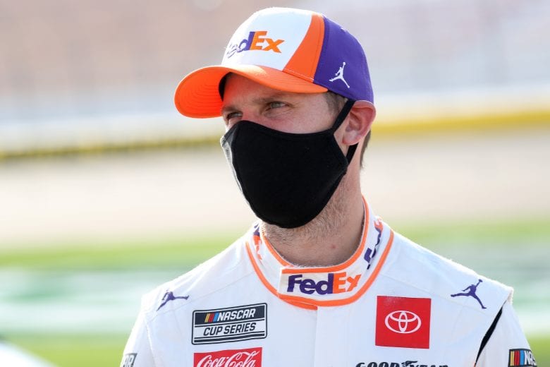 LAS VEGAS, NEVADA - SEPTEMBER 27: Denny Hamlin, driver of the #11 FedEx Office Toyota, stands on the grid prior to the NASCAR Cup Series South Point 400 at Las Vegas Motor Speedway on September 27, 2020 in Las Vegas, Nevada. (Photo by Chris Graythen/Getty Images) | Getty Images