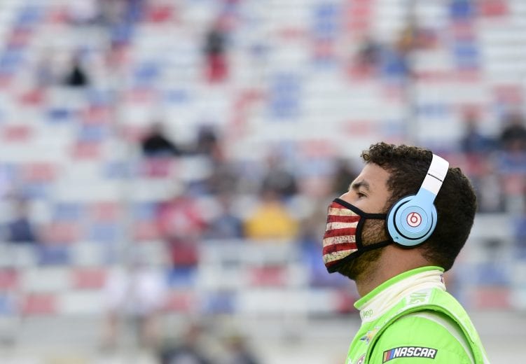 BRISTOL, TENNESSEE - SEPTEMBER 19: Bubba Wallace, driver of the #43 Cash App Chevrolet, stands on the grid prior to the NASCAR Cup Series Bass Pro Shops Night Race at Bristol Motor Speedway on September 19, 2020 in Bristol, Tennessee. (Photo by Jared C. Tilton/Getty Images) | Getty Images