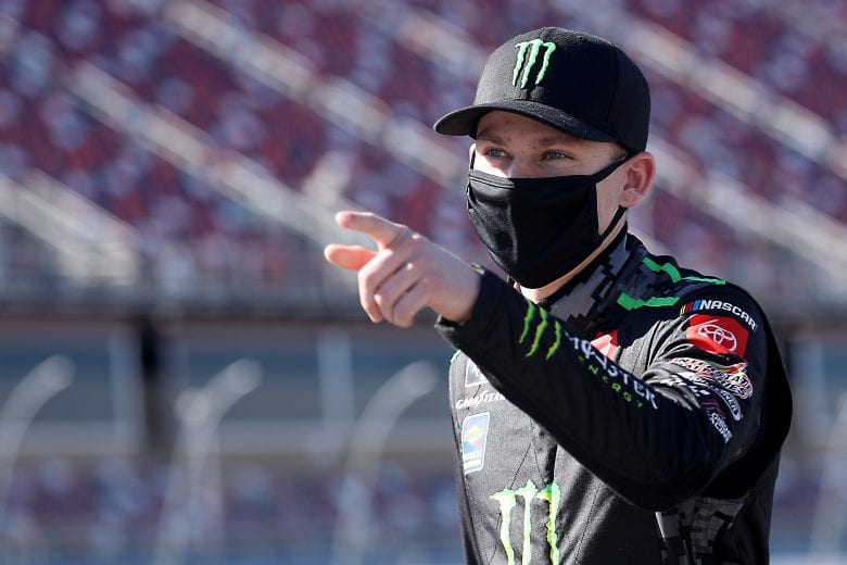TALLADEGA, ALABAMA - OCTOBER 03: Riley Herbst, driver of the #18 Monster Energy Toyota, walks the grid prior to the NASCAR Xfinity Series Ag-Pro 300 at Talladega Superspeedway on October 03, 2020 in Talladega, Alabama. (Photo by Chris Graythen/Getty Images) | Getty Images