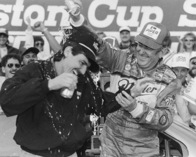 DAYTONA BEACH, FL - FEBRUARY 14:  Bobby Allison driver of the #12 Buick celebrates with his son Davey (Feb 25, 1961-July 13, 1993) driver of the Robert Yates Racing #28 Texaco-Havoline Ford after winning the 1988 NASCAR Winston Cup Daytona 500 at the Daytona International Speedway on February 14, 1988 in Daytona Beach, Florida.  (Photo by ISC Archives/CQ-Roll Call Group via Getty Images)