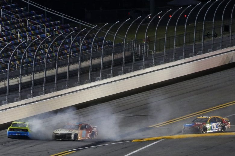 DAYTONA BEACH, FLORIDA - FEBRUARY 09: Ryan Blaney, driver of the #12 Menards/Great Lakes Flooring Ford, and Chase Elliott, driver of the #9 Llumar Chevrolet, wreck as Kyle Busch, driver of the #18 M&M's Toyota, drives past to win the NASCAR Cup Series Busch Clash at Daytona at Daytona International Speedway on February 09, 2021 in Daytona Beach, Florida. (Photo by Brian Lawdermilk/Getty Images) | Getty Images