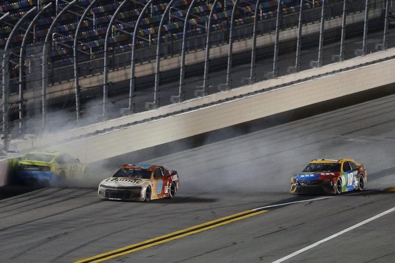DAYTONA BEACH, FLORIDA - FEBRUARY 09: Ryan Blaney, driver of the #12 Menards/Great Lakes Flooring Ford, and Chase Elliott, driver of the #9 Llumar Chevrolet, wreck as Kyle Busch, driver of the #18 M&M's Toyota, drives past to win the NASCAR Cup Series Busch Clash at Daytona at Daytona International Speedway on February 09, 2021 in Daytona Beach, Florida. (Photo by Brian Lawdermilk/Getty Images) | Getty Images