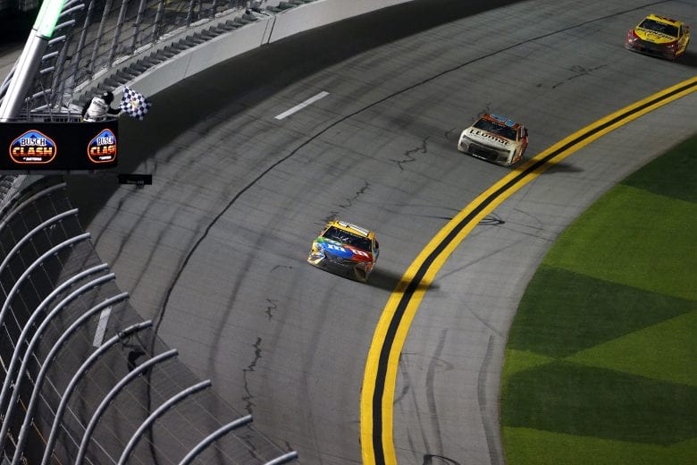 DAYTONA BEACH, FLORIDA - FEBRUARY 09: Kyle Busch, driver of the #18 M&M's Toyota, takes the checkered flag to win the NASCAR Cup Series Busch Clash at Daytona at Daytona International Speedway on February 09, 2021 in Daytona Beach, Florida. (Photo by Brian Lawdermilk/Getty Images) | Getty Images