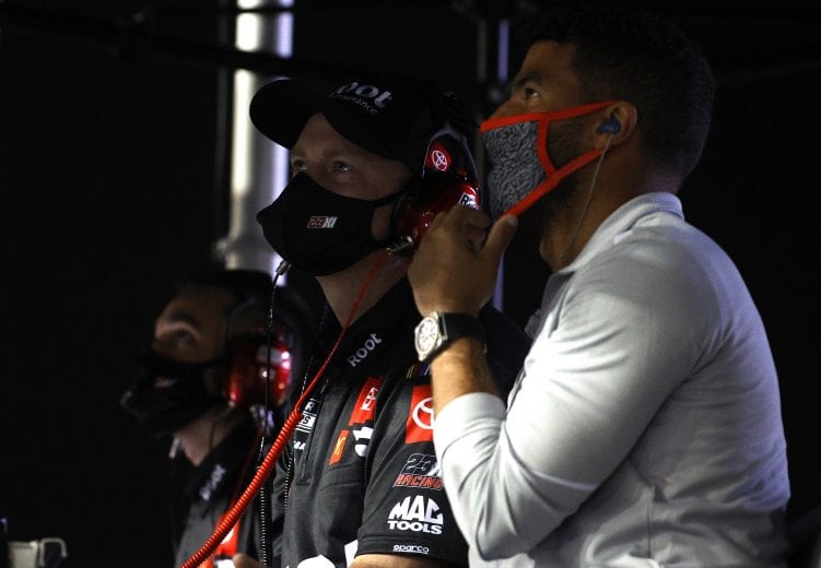 DAYTONA BEACH, FLORIDA - FEBRUARY 09: Crew chief Michael Wheeler and Bubba Wallace look on from the #23 Root Insurance Toyota, pit box during the NASCAR Cup Series Busch Clash at Daytona at Daytona International Speedway on February 09, 2021 in Daytona Beach, Florida. (Photo by Chris Graythen/Getty Images) | Getty Images