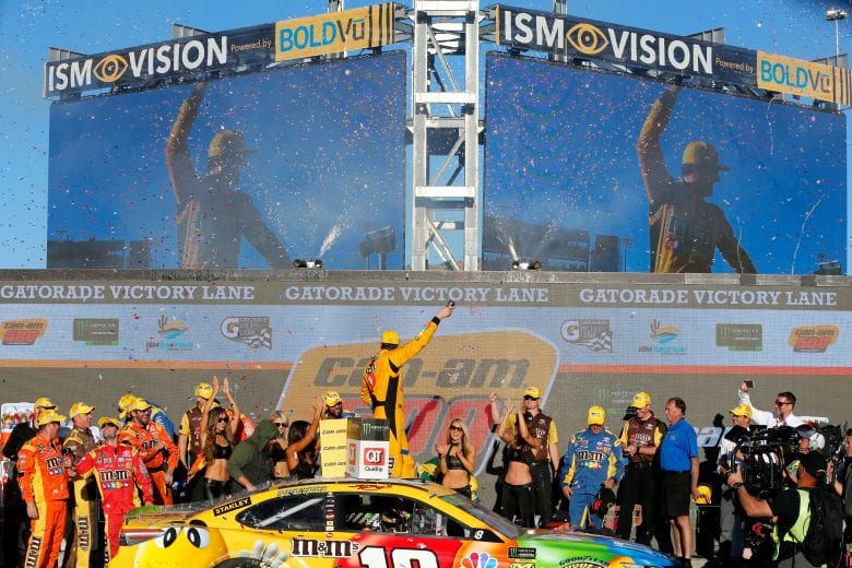 PHOENIX, AZ - NOVEMBER 11: Kyle Busch, driver of the #18 M&M's Toyota, celebrates in Victory Lane after winning the Monster Energy NASCAR Cup Series Can-Am 500 at ISM Raceway on November 11, 2018 in Phoenix, Arizona. (Photo by Jonathan Ferrey/Getty Images) | Getty Images