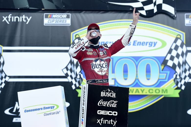 BROOKLYN, MICHIGAN - AUGUST 09: Kevin Harvick, driver of the #4 Busch Light Apple Ford, celebrates in Victory Lane after winning the NASCAR Cup Series Consumers Energy 400 at Michigan International Speedway on August 09, 2020 in Brooklyn, Michigan. (Photo by Jared C. Tilton/Getty Images) | Getty Images