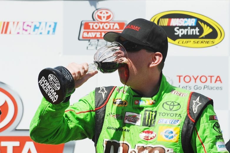 SONOMA, CA - JUNE 28: Kyle Busch, driver of the #18 M&M's Crispy Toyota, celebrates in Victory Lane after winning the NASCAR Sprint Cup Series Toyota/Save Mart 350 at Sonoma Raceway on June 28, 2015 in Sonoma, California. (Photo by Rainier Ehrhardt/NASCAR via Getty Images)