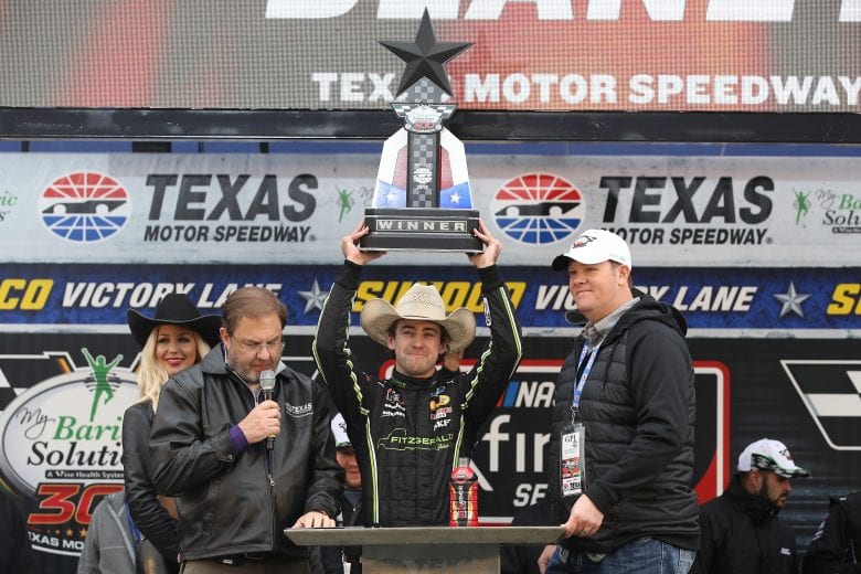 FORT WORTH, TX - APRIL 07: Ryan Blaney, driver of the #22 Fitzgerald Glider Kits Ford, celebrates with the trophy in Victory Lane after winning the NASCAR Xfinity Series My Bariatric Solutions 300 at Texas Motor Speedway on April 7, 2018 in Fort Worth, Texas. (Photo by Chris Graythen/Getty Images) | Getty Images