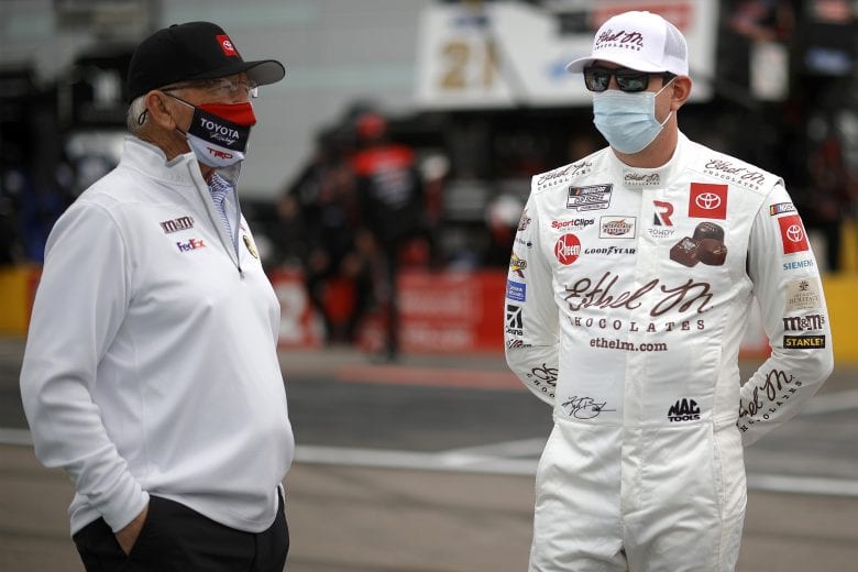 LAS VEGAS, NEVADA - MARCH 07: Team owner Joe Gibbs, and Kyle Busch, driver of the #18 Ethel M Chocolates Toyota, talk on the grid prior to the NASCAR Cup Series Pennzoil 400 presented by Jiffy Lube at Las Vegas Motor Speedway on March 07, 2021 in Las Vegas, Nevada. (Photo by Chris Graythen/Getty Images) | Getty Images