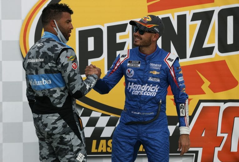 LAS VEGAS, NEVADA - MARCH 07: Kyle Larson, driver of the #5 HendrickCars.com Chevrolet, is congratulated by Bubba Wallace, driver of the #23 Columbia Sportswear Toyota, in Victory Lane after winning the NASCAR Cup Series Pennzoil 400 presented by Jiffy Lube at the Las Vegas Motor Speedway on March 07, 2021 in Las Vegas, Nevada. (Photo by Chris Graythen/23XI Racing via Getty Images)