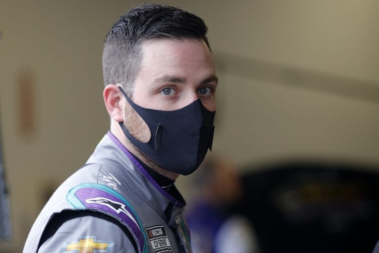 DAYTONA BEACH, FLORIDA - FEBRUARY 13: Alex Bowman, driver of the #48 Ally Chevrolet, stands in the garage area during practice for the NASCAR Cup Series 63rd Annual Daytona 500 at Daytona International Speedway on February 13, 2021 in Daytona Beach, Florida. (Photo by Chris Graythen/Getty Images) | Getty Images