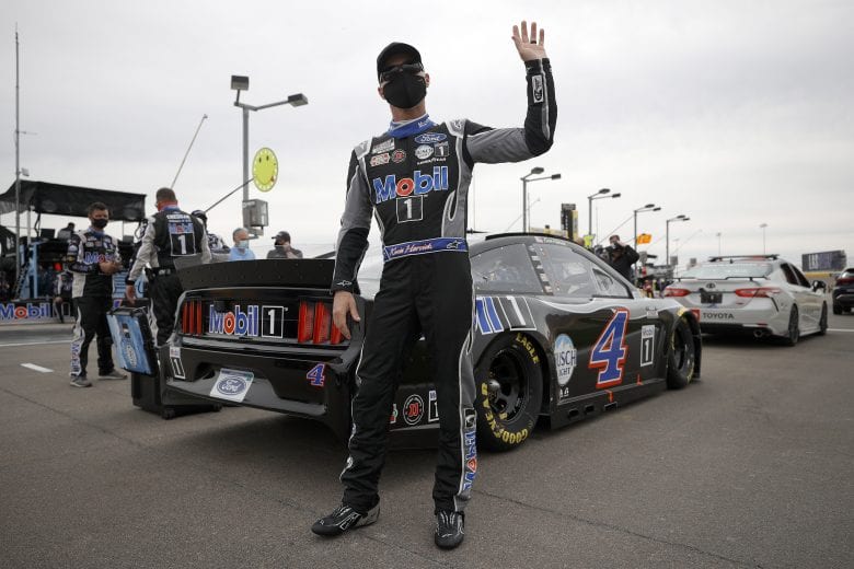 LAS VEGAS, NEVADA - MARCH 07: Kevin Harvick, driver of the #4 Mobil 1 Ford, waves to fans from the grid prior to the NASCAR Cup Series Pennzoil 400 presented by Jiffy Lube at Las Vegas Motor Speedway on March 07, 2021 in Las Vegas, Nevada. (Photo by Chris Graythen/Getty Images) | Getty Images