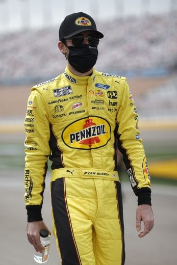 LAS VEGAS, NEVADA - MARCH 07: Ryan Blaney, driver of the #12 Menards/Pennzoil Ford, walks the grid prior to the NASCAR Cup Series Pennzoil 400 presented by Jiffy Lube at Las Vegas Motor Speedway on March 07, 2021 in Las Vegas, Nevada. (Photo by Chris Graythen/Getty Images) | Getty Images