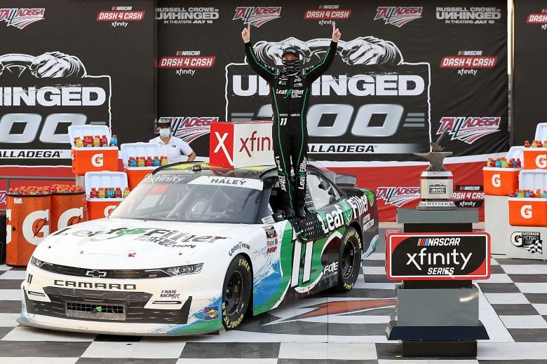 TALLADEGA, ALABAMA - JUNE 20: Justin Haley, driver of the #11 LeafFilter Gutter Protection Chevrolet, celebrates in Victory Lane after winning the NASCAR Xfinity Series Unhinged 300 at Talladega Superspeedway on June 20, 2020 in Talladega, Alabama. (Photo by Chris Graythen/Getty Images) | Getty Images