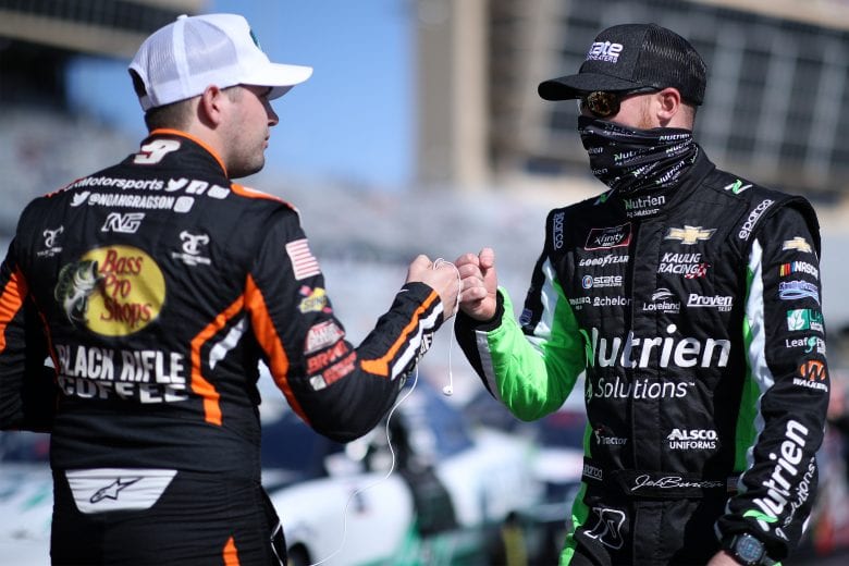 HAMPTON, GEORGIA - MARCH 20: Jeb Burton, driver of the #10 Nutrien Chevrolet, and Noah Gragson, driver of the #9 Bass Pros Shops/TrueTimber/BRCC Chevrolet, fist-bump on the grid prior to the NASCAR Xfinity Series EchoPark 250 at Atlanta Motor Speedway on March 20, 2021 in Hampton, Georgia. (Photo by Sean Gardner/Getty Images) | Getty Images