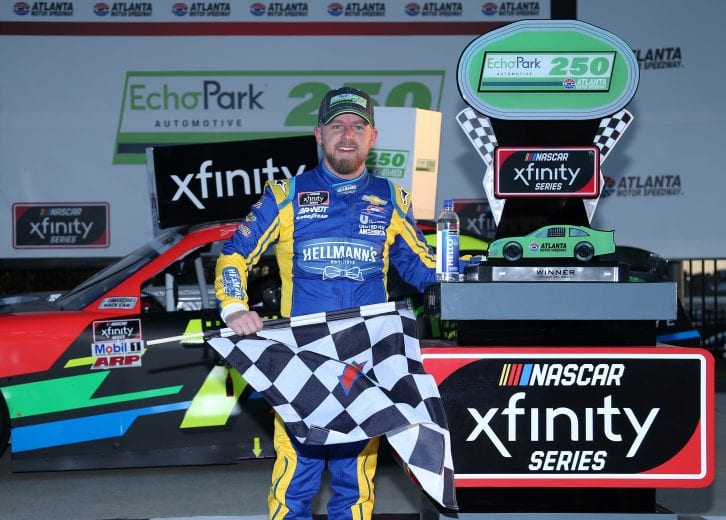 HAMPTON, GEORGIA - MARCH 20: Justin Allgaier, driver of the #7 Axalta/EchoPark Automotive Chevrolet, celebrates in victory lane after winning the NASCAR Xfinity Series EchoPark 250 at Atlanta Motor Speedway on March 20, 2021 in Hampton, Georgia. (Photo by Sean Gardner/Getty Images) | Getty Images
