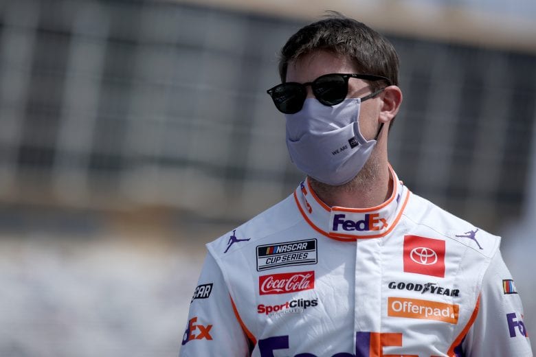 HAMPTON, GEORGIA - MARCH 21: Denny Hamlin, driver of the #11 FedEx Express Toyota, walks the grid prior to the NASCAR Cup Series Folds of Honor QuikTrip 500 at Atlanta Motor Speedway on March 21, 2021 in Hampton, Georgia. (Photo by Sean Gardner/Getty Images) | Getty Images