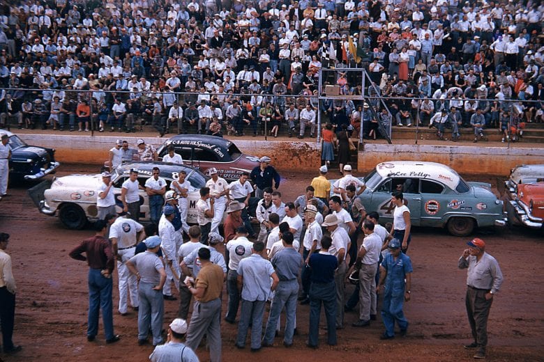 1953: NASCAR Cup drivers meet with officials at the start-finish line before a dirt track Cup race. (Photo by ISC Images & Archives via Getty Images)