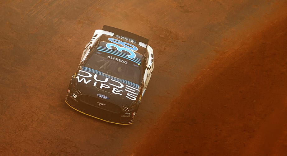 BRISTOL, TENNESSEE - MARCH 26: Kyle Busch, driver of the #18 M&M's Messages Toyota, and Anthony Alfredo, driver of the #38 Dude Wipes Ford, race during practice for the NASCAR Cup Series Food City Dirt Race at Bristol Motor Speedway on March 26, 2021 in Bristol, Tennessee. (Photo by Jared C. Tilton/Getty Images) | Getty Images