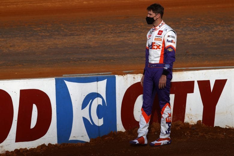 BRISTOL, TENNESSEE - MARCH 26: Denny Hamlin, driver of the #11 FedEx Freight Toyota, looks on during practice for the NASCAR Cup Series Food City Dirt Race at Bristol Motor Speedway on March 26, 2021 in Bristol, Tennessee. (Photo by Chris Graythen/Getty Images) | Getty Images