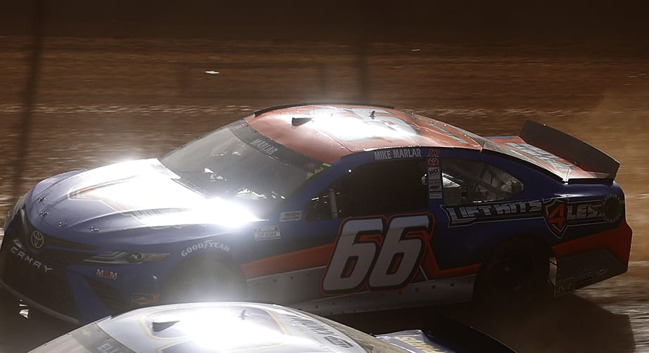 BRISTOL, TENNESSEE - MARCH 26: Chase Elliott, driver of the #9 NAPA Auto Parts Chevrolet, and Mike Marlar, driver of the #66 Auto Parts For Less Toyota, race during practice for the NASCAR Cup Series Food City Dirt Race at Bristol Motor Speedway on March 26, 2021 in Bristol, Tennessee. (Photo by Chris Graythen/Getty Images) | Getty Images