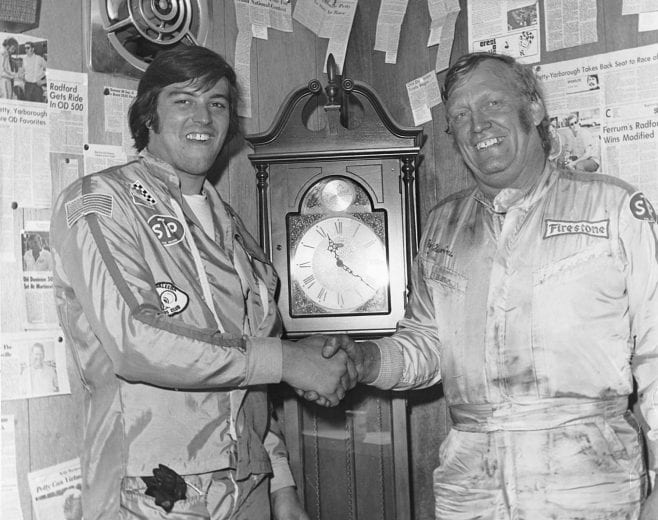 MARTINSVILLE, VA — October 27, 1974:  After winning their respective races in the Cardinal 500 Classic at Martinsville Speedway, Ron Bouchard (L) and Ray Hendrick (R) pose with one of the grandfather clocks that are awarded to the victors.  Bouchard won the NASCAR Modified portion of the event, while Hendrick took home the win in the NASCAR Late Model Sportsman race.   (Photo by ISC Images & Archives via Getty Images)