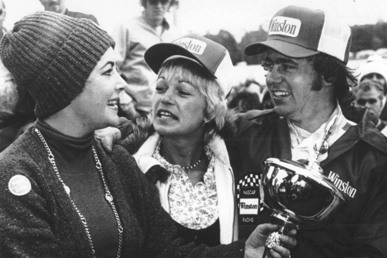 MARTINSVILLE, VA - 1976:  Actress Elizabeth Taylor joins Geoff Bodine in victory lane after Bodine won the NASCAR Modified portion of the Cardinal 500 at Martinsville Speedway. (Photo by ISC Images & Archives via Getty Images)