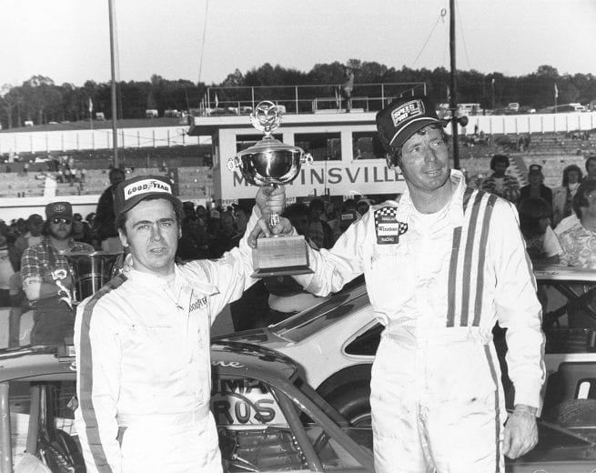 MARTINSVILLE, VA — October 29, 1978:  Geoff Bodine (L) and Sam Ard (R) celebrate in victory lane at Martinsville Speedway following the Cardinal 500 Classic.  Bodine took the win in the NASCAR Modified Tour segment while Ard took the checkered first in the NASCAR Late Model Sportsman half.  (Photo by ISC Images & Archives via Getty Images)
