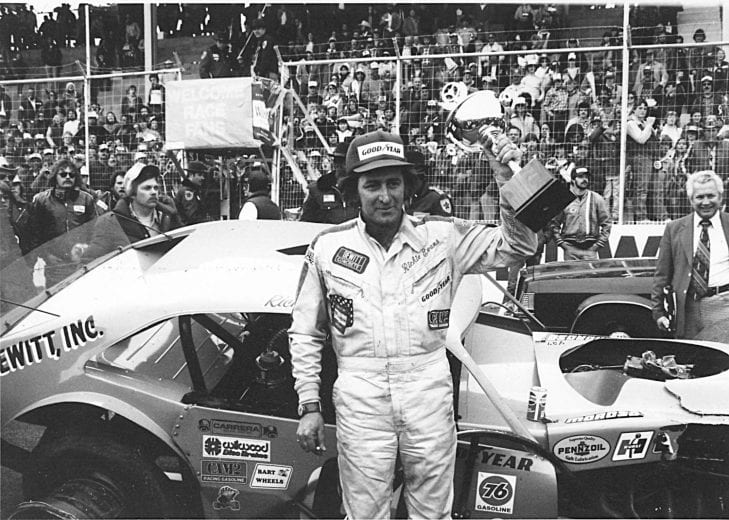 MARTINSVILLE, VA - 1981:  Although his car is a bit the worse for wear, NASCAR Modified driver Richie Evans raises another trophy after an obviously hard-fought victory over Geoff Bodine in the most spectacular bump-and-grind finish at the track. (Photo by ISC Images & Archives via Getty Images)