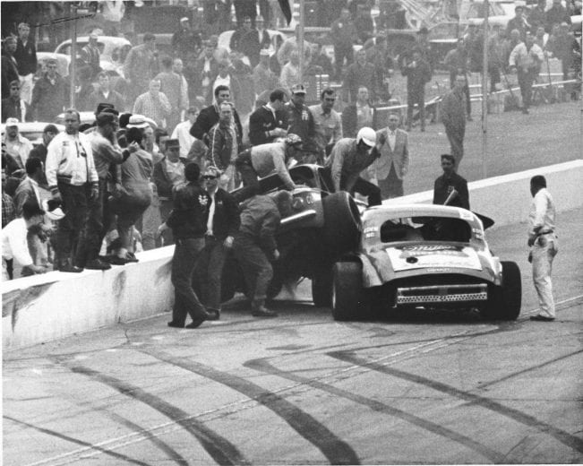 MARTINSVILLE, VA:  Billy Hensley climbs from his Modified racer after a crash.  (Photo by ISC Archives/CQ-Roll Call Group via Getty Images)