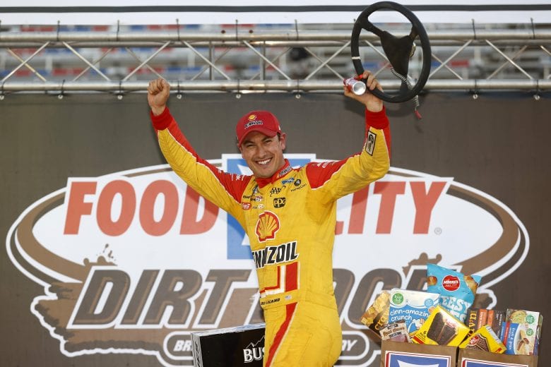 BRISTOL, TENNESSEE - MARCH 29: Joey Logano, driver of the #22 Shell Pennzoil Ford, celebrates in victory lane after winning the NASCAR Cup Series Food City Dirt Race at Bristol Motor Speedway on March 29, 2021 in Bristol, Tennessee. (Photo by Chris Graythen/Getty Images) | Getty Images