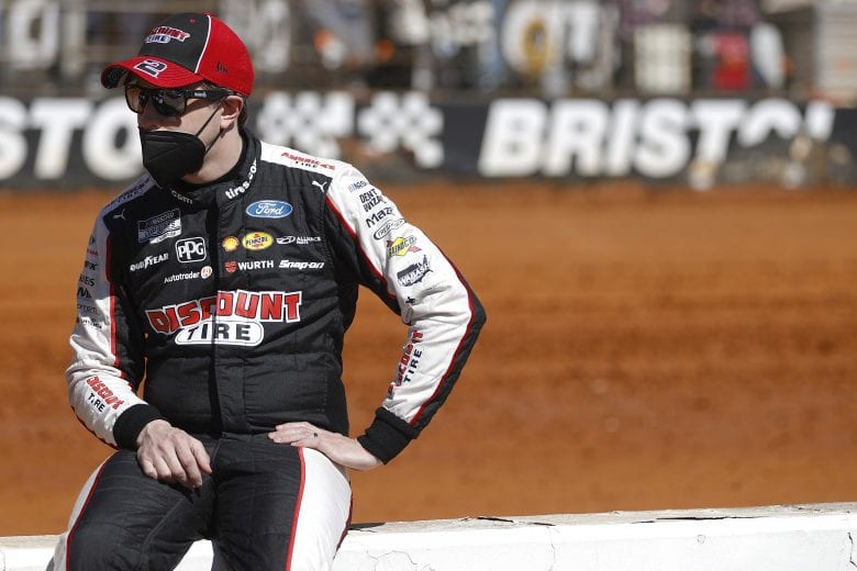 BRISTOL, TENNESSEE - MARCH 29: Brad Keselowski, driver of the #2 Discount Tire Ford, waits on the grid prior to the NASCAR Cup Series Food City Dirt Race at Bristol Motor Speedway on March 29, 2021 in Bristol, Tennessee. (Photo by Chris Graythen/Getty Images) | Getty Images