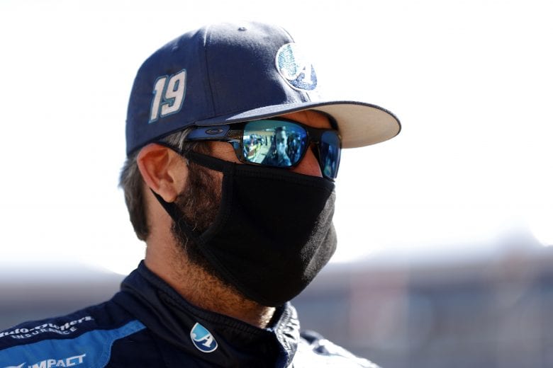 BRISTOL, TENNESSEE - MARCH 29: Martin Truex Jr., driver of the #19 Auto-Owners Insurance Toyota, stands on the grid during the NASCAR Cup Series Food City Dirt Race at Bristol Motor Speedway on March 29, 2021 in Bristol, Tennessee. (Photo by Chris Graythen/Getty Images) | Getty Images